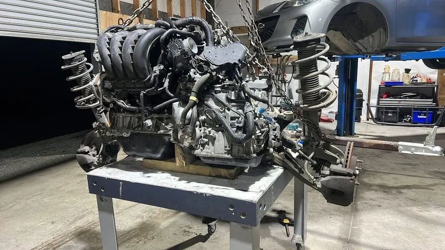 An engine and subframe out on the bench for rebuild work