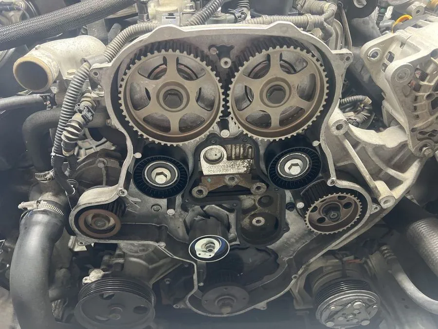 Fresh timing gears and belt fitted to an engine